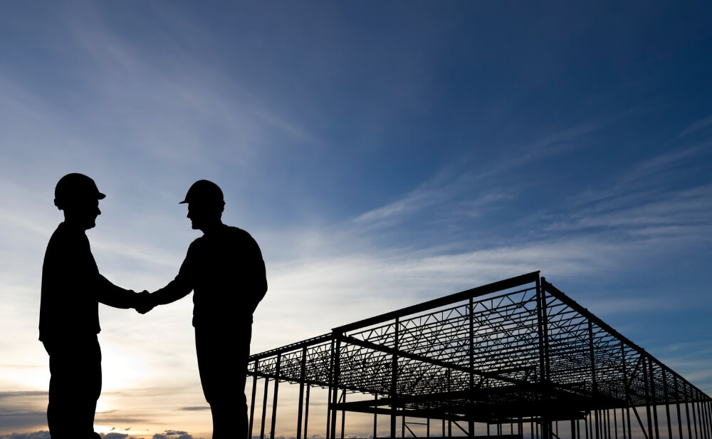 Promisiunea noastră Două persoane care încheie o înțelegere printr-o strângere de mână